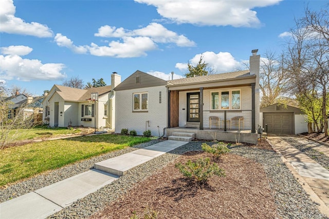 1220 Ash St, Denver, CO 80220 - single story home featuring brick siding, a porch, an outdoor structure, and a chimney