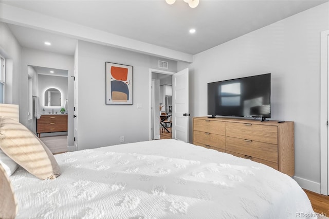 1220 Ash St, Denver, CO 80220 - bedroom featuring baseboards, recessed lighting, visible vents, and wood finished floors