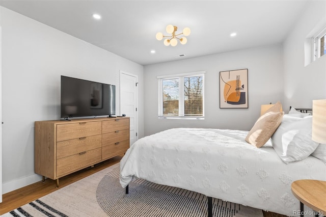 1220 Ash St, Denver, CO 80220 - bedroom with visible vents, wood finished floors, baseboards, and recessed lighting