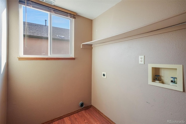 laundry area with hardwood / wood-style flooring, washer hookup, and electric dryer hookup