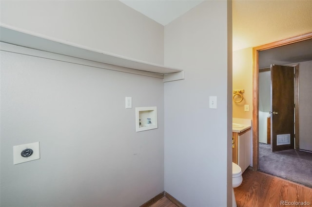 laundry room with washer hookup, hookup for an electric dryer, and wood-type flooring