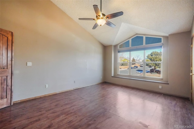 interior space with hardwood / wood-style floors, vaulted ceiling, a textured ceiling, and ceiling fan