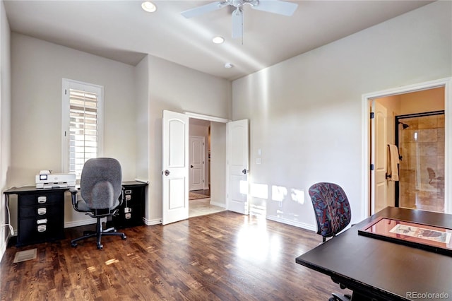 office area with dark wood-style floors, baseboards, and a ceiling fan