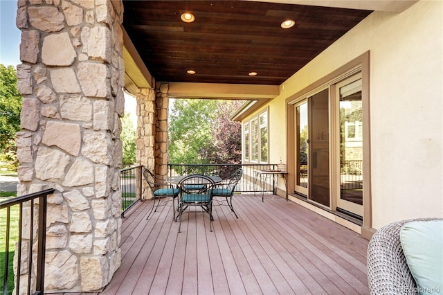 wooden deck with outdoor dining area