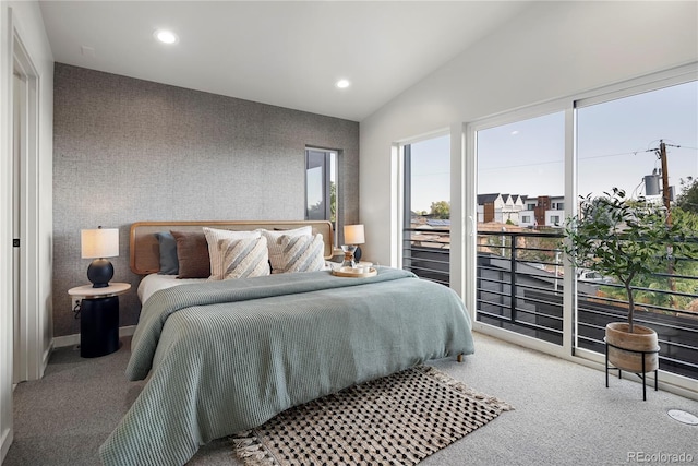 carpeted bedroom featuring lofted ceiling, wallpapered walls, an accent wall, and recessed lighting