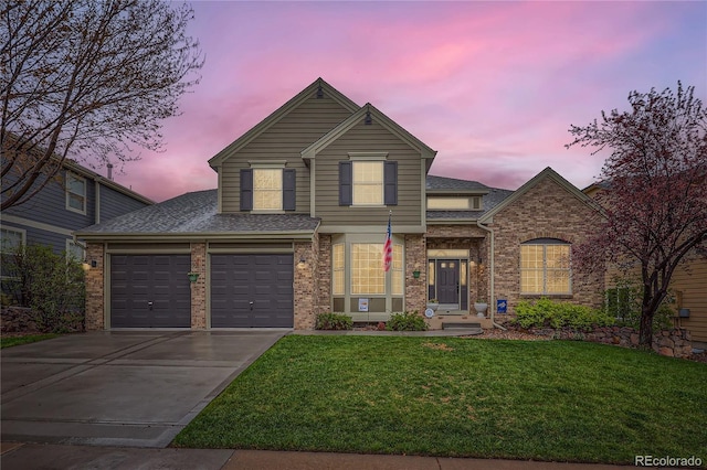 527 Stonemont Dr, Castle Pines, CO 80108 - traditional-style house with concrete driveway, a lawn, roof with shingles, and brick siding