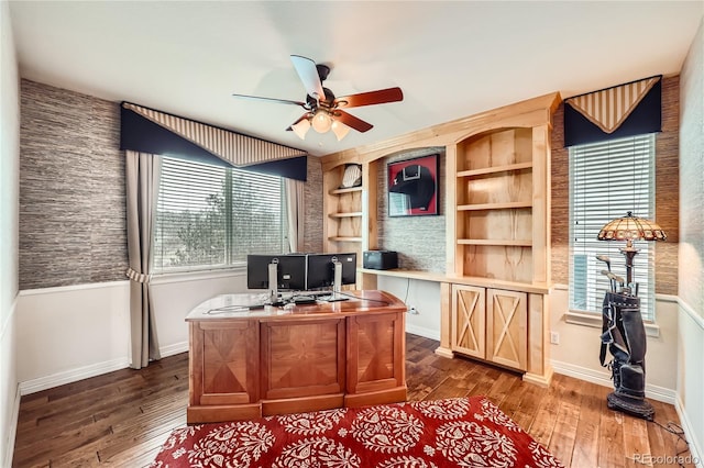 527 Stonemont Dr, Castle Pines, CO 80108 - home office with ceiling fan, dark wood-style flooring, baseboards, and built in features