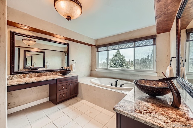 527 Stonemont Dr, Castle Pines, CO 80108 - bathroom with a garden tub, vanity, and tile patterned floors