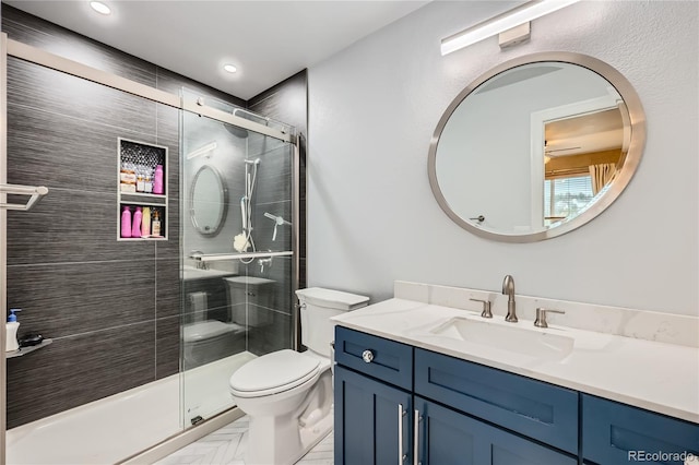 527 Stonemont Dr, Castle Pines, CO 80108 - full bathroom featuring toilet, a stall shower, vanity, and recessed lighting
