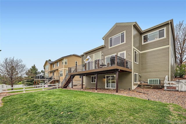 527 Stonemont Dr, Castle Pines, CO 80108 - rear view of house with a wooden deck and stairway