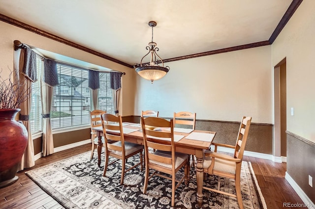 527 Stonemont Dr, Castle Pines, CO 80108 - dining space featuring hardwood / wood-style floors, ornamental molding, and baseboards