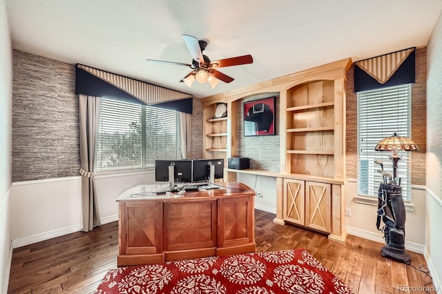 527 Stonemont Dr, Castle Pines, CO 80108 - office with a ceiling fan, baseboards, dark wood-style floors, and built in features