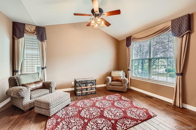 527 Stonemont Dr, Castle Pines, CO 80108 - sitting room featuring lofted ceiling, ceiling fan, wood finished floors, and baseboards
