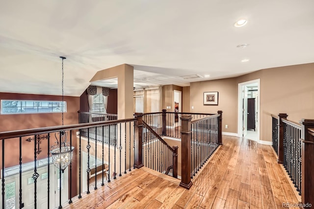 527 Stonemont Dr, Castle Pines, CO 80108 - corridor with an upstairs landing, wood finished floors, baseboards, and recessed lighting