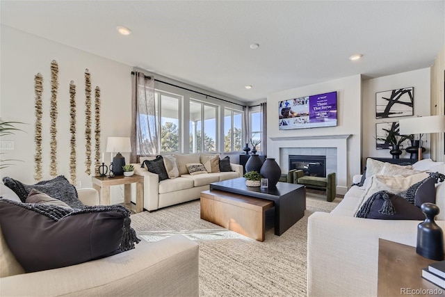 living room with recessed lighting and a fireplace