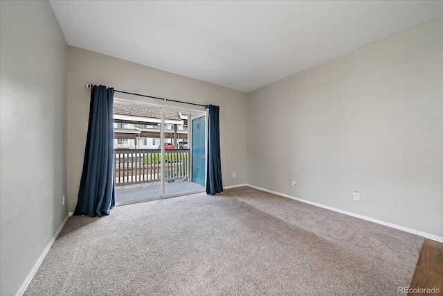 unfurnished room featuring baseboards and carpet floors