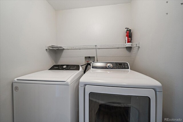 laundry area with washer and dryer