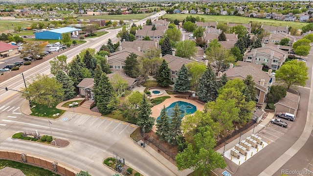 aerial perspective of suburban area featuring a pool