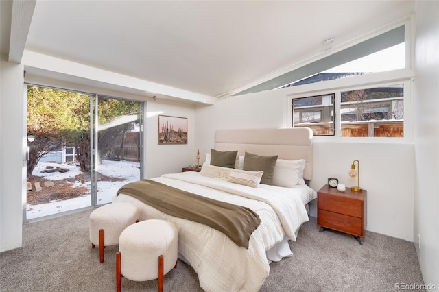 carpeted bedroom with multiple windows, access to exterior, and vaulted ceiling