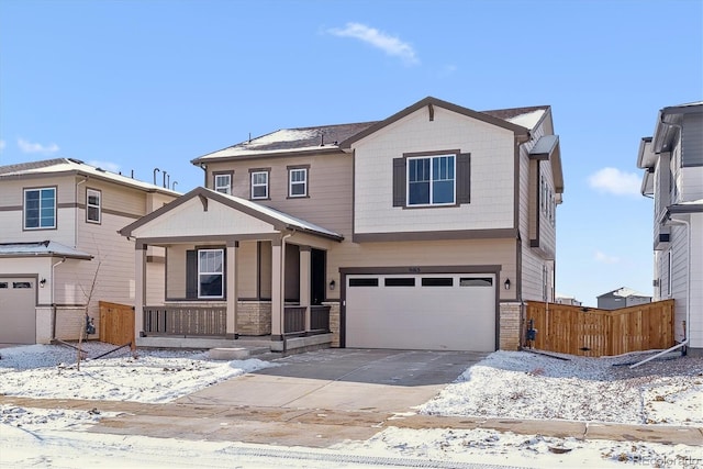 view of front of property featuring a garage and covered porch