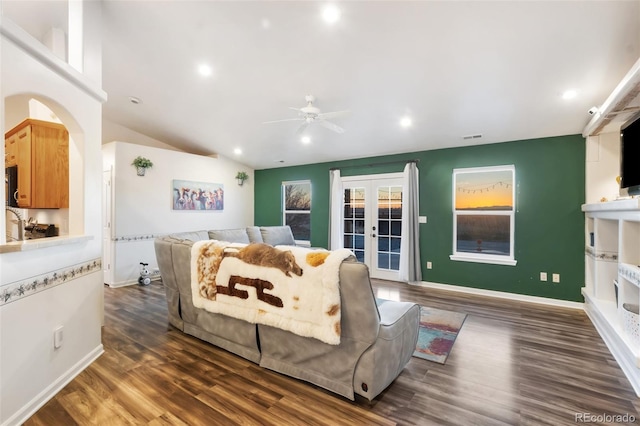 living area with dark wood finished floors, french doors, and baseboards