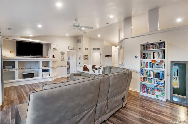 living area featuring a ceiling fan, lofted ceiling, and wood finished floors