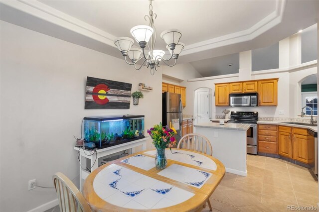 dining space with light tile patterned floors, a raised ceiling, a notable chandelier, and arched walkways