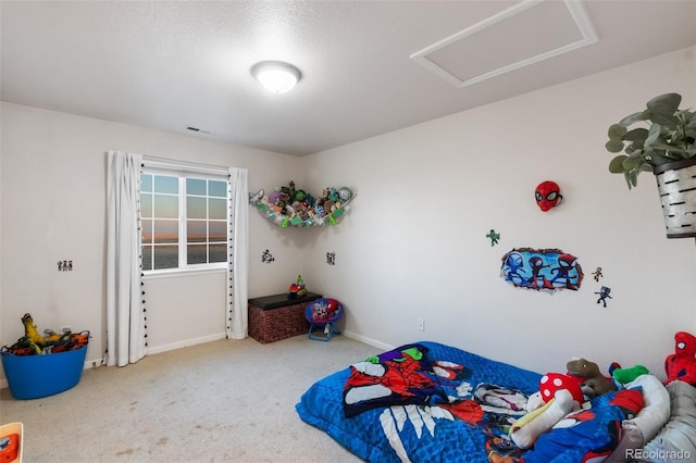 bedroom featuring baseboards, visible vents, carpet floors, and attic access