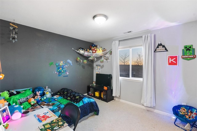 bedroom with carpet flooring, baseboards, and visible vents