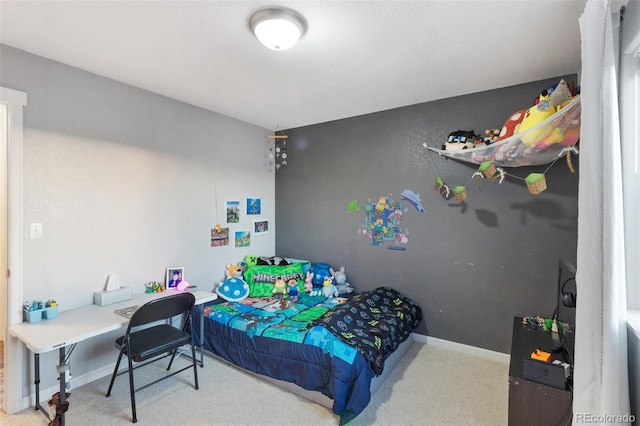 bedroom featuring carpet and baseboards