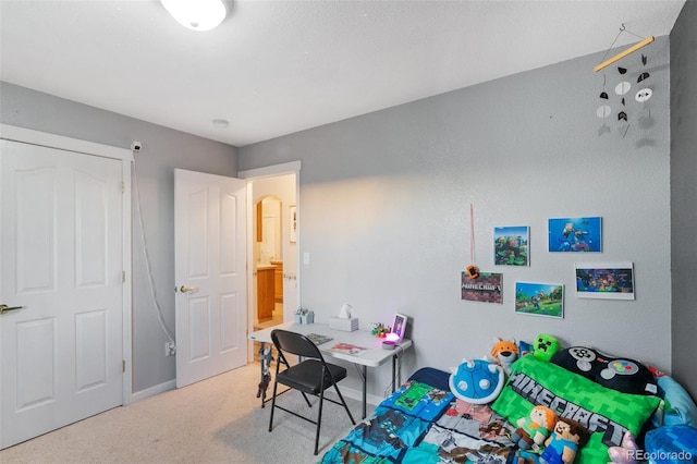 carpeted bedroom featuring baseboards and arched walkways