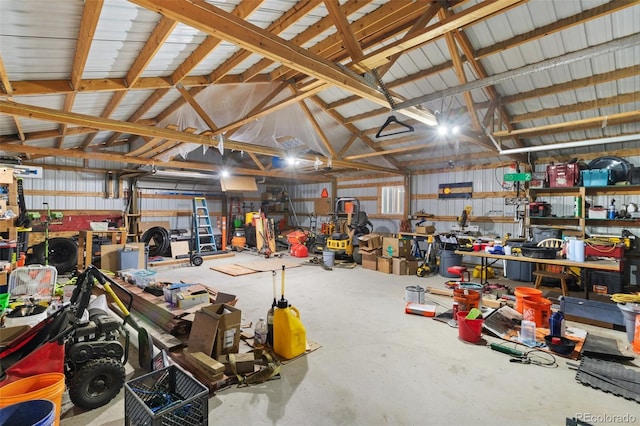 garage featuring metal wall and a workshop area