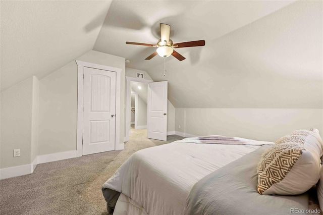 bedroom featuring vaulted ceiling, ceiling fan, and light colored carpet