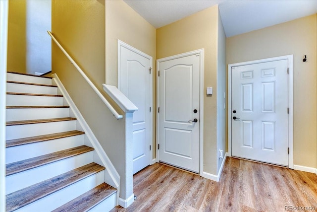 31112 Black Eagle Dr Unit 101, Evergreen, CO 80439 - entrance foyer with wood finished floors and stairs