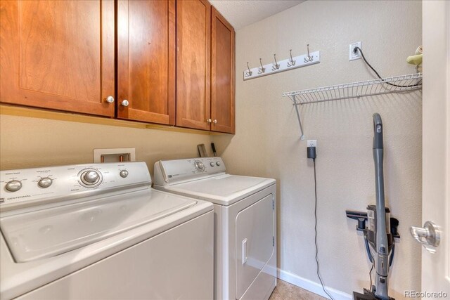 31112 Black Eagle Dr Unit 101, Evergreen, CO 80439 - laundry room with washing machine and dryer and cabinet space