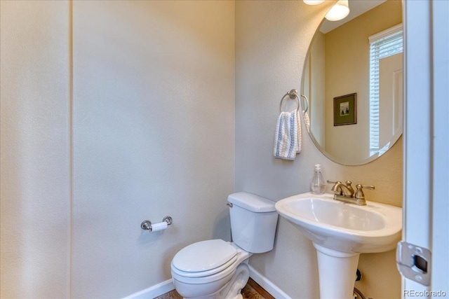 31112 Black Eagle Dr Unit 101, Evergreen, CO 80439 - half bathroom featuring toilet and baseboards