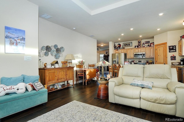 living room with recessed lighting, visible vents, and dark wood-style flooring