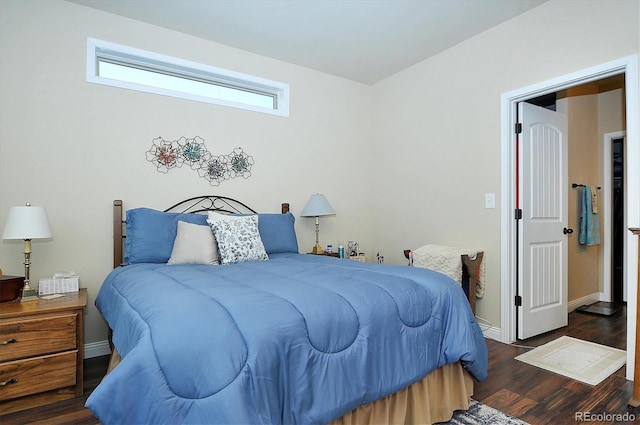 bedroom with dark wood-type flooring