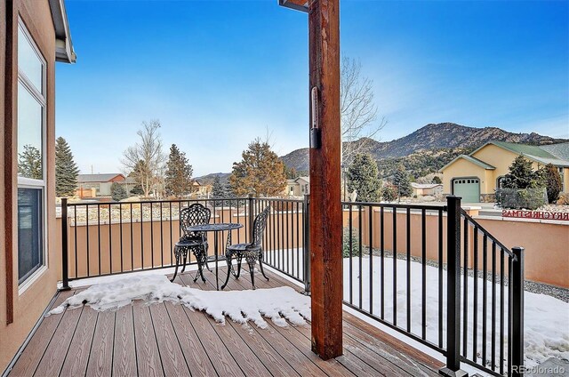 wooden deck with a mountain view