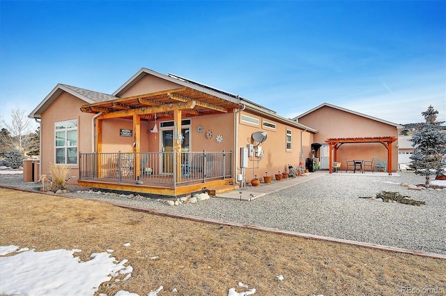 view of front of home featuring a patio area and a pergola