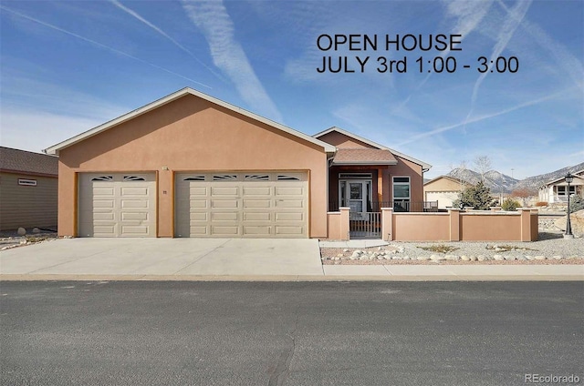 27665 County Road 313 Unit 11, Buena Vista, CO 81211 - view of front of house featuring an attached garage, stucco siding, and driveway
