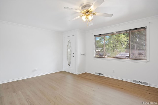 971 S Ironton St, Aurora, CO 80012 - spare room with crown molding, wood finished floors, and ceiling fan