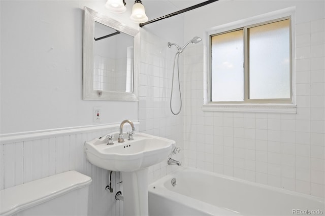 971 S Ironton St, Aurora, CO 80012 - full bath featuring shower / washtub combination and wainscoting