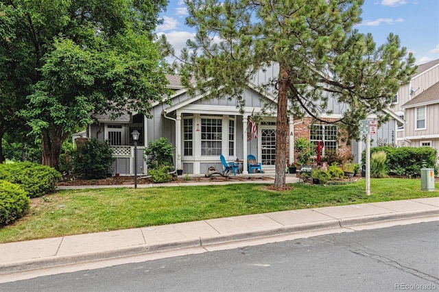 2992 W Long Dr Unit A, Littleton, CO 80120 - obstructed view of property featuring a front yard