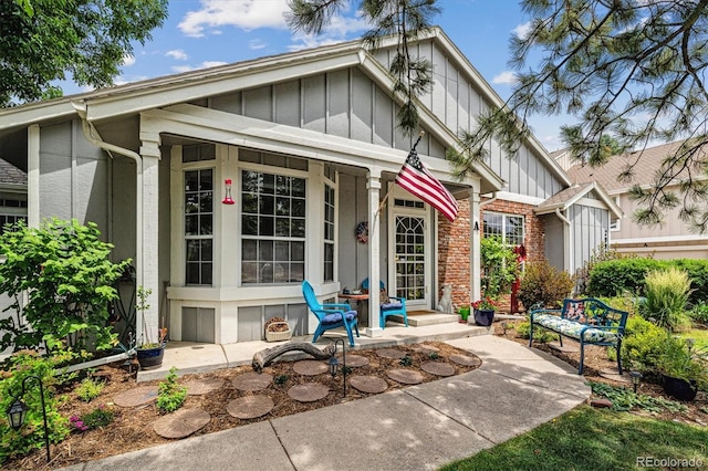 2992 W Long Dr Unit A, Littleton, CO 80120 - view of front of property featuring board and batten siding and brick siding