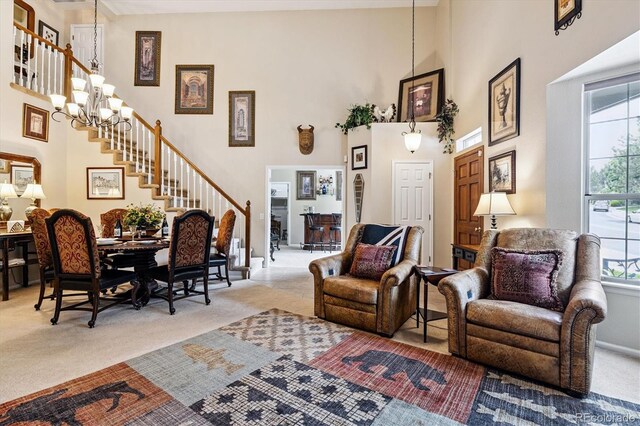 2992 W Long Dr Unit A, Littleton, CO 80120 - living area with carpet, a towering ceiling, stairway, and healthy amount of natural light