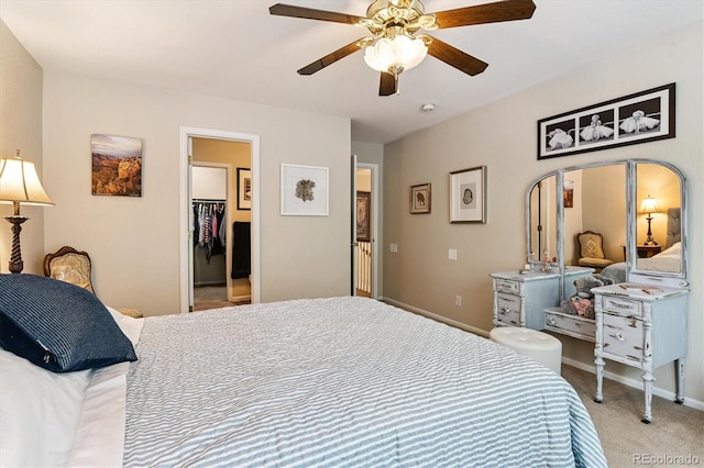 2992 W Long Dr Unit A, Littleton, CO 80120 - bedroom with carpet floors, a walk in closet, ceiling fan, and a closet