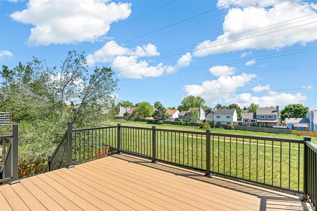 wooden terrace with a residential view