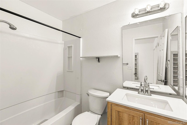 full bathroom featuring toilet, shower / washtub combination, and vanity