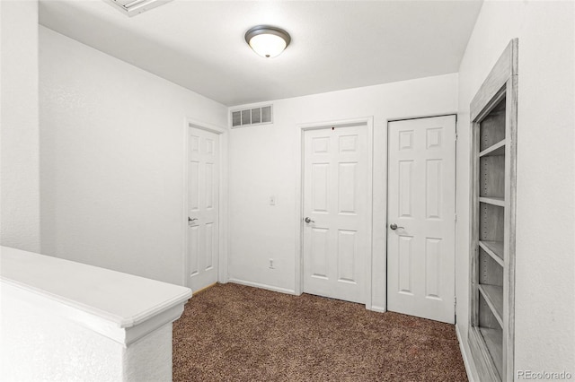 hallway featuring carpet floors